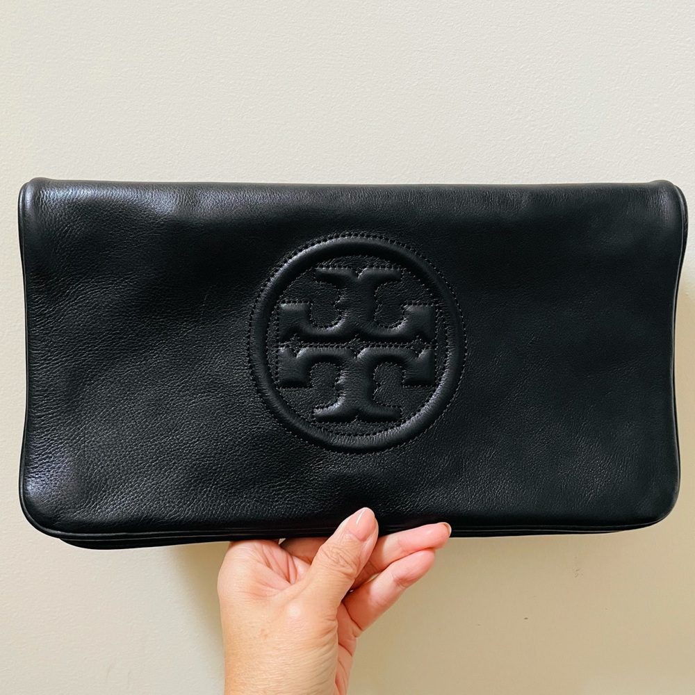 Tory Burch Bombe Reva black clutch with removable gold chain.